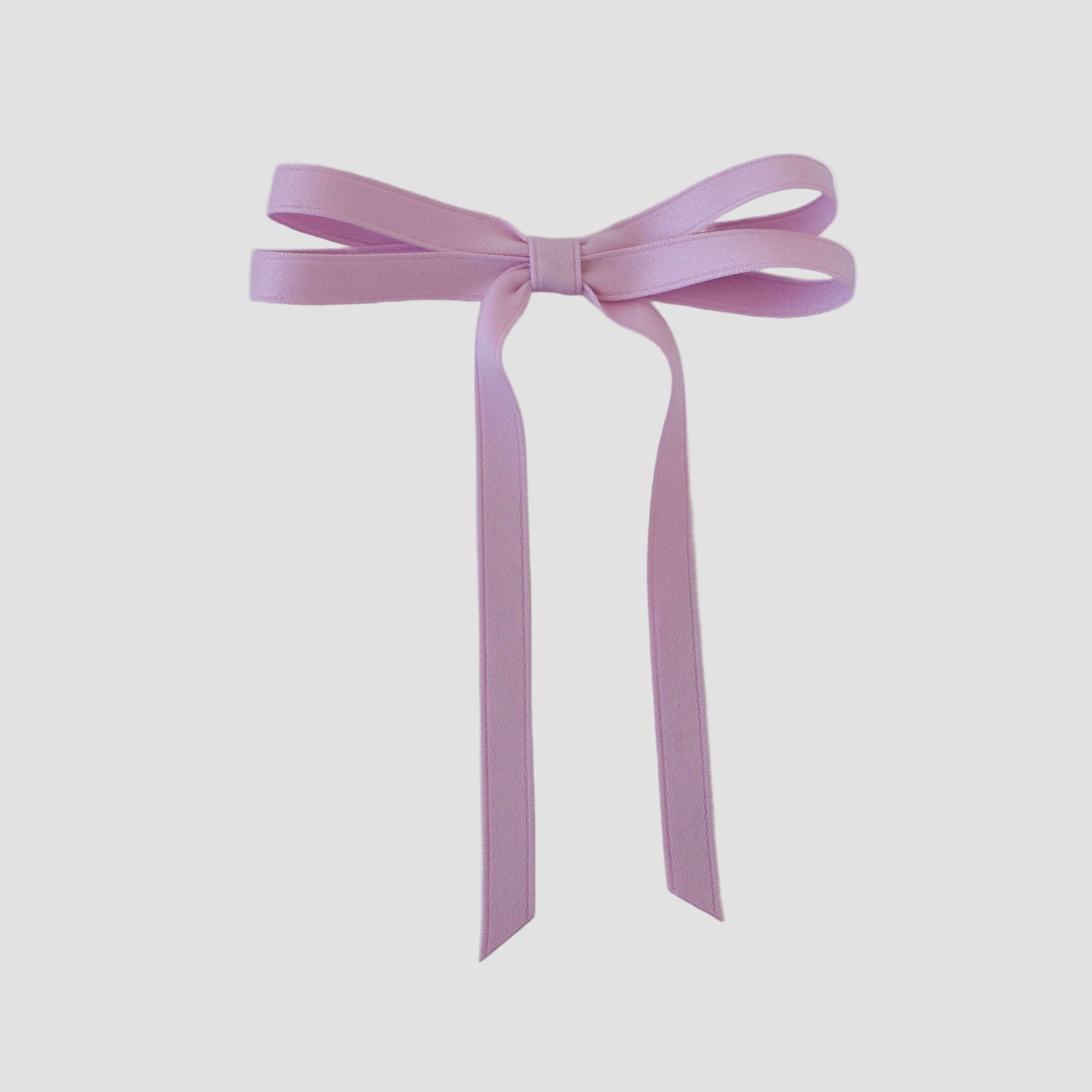 Olivia petite matte satin hair bow in lavender on a white background.
