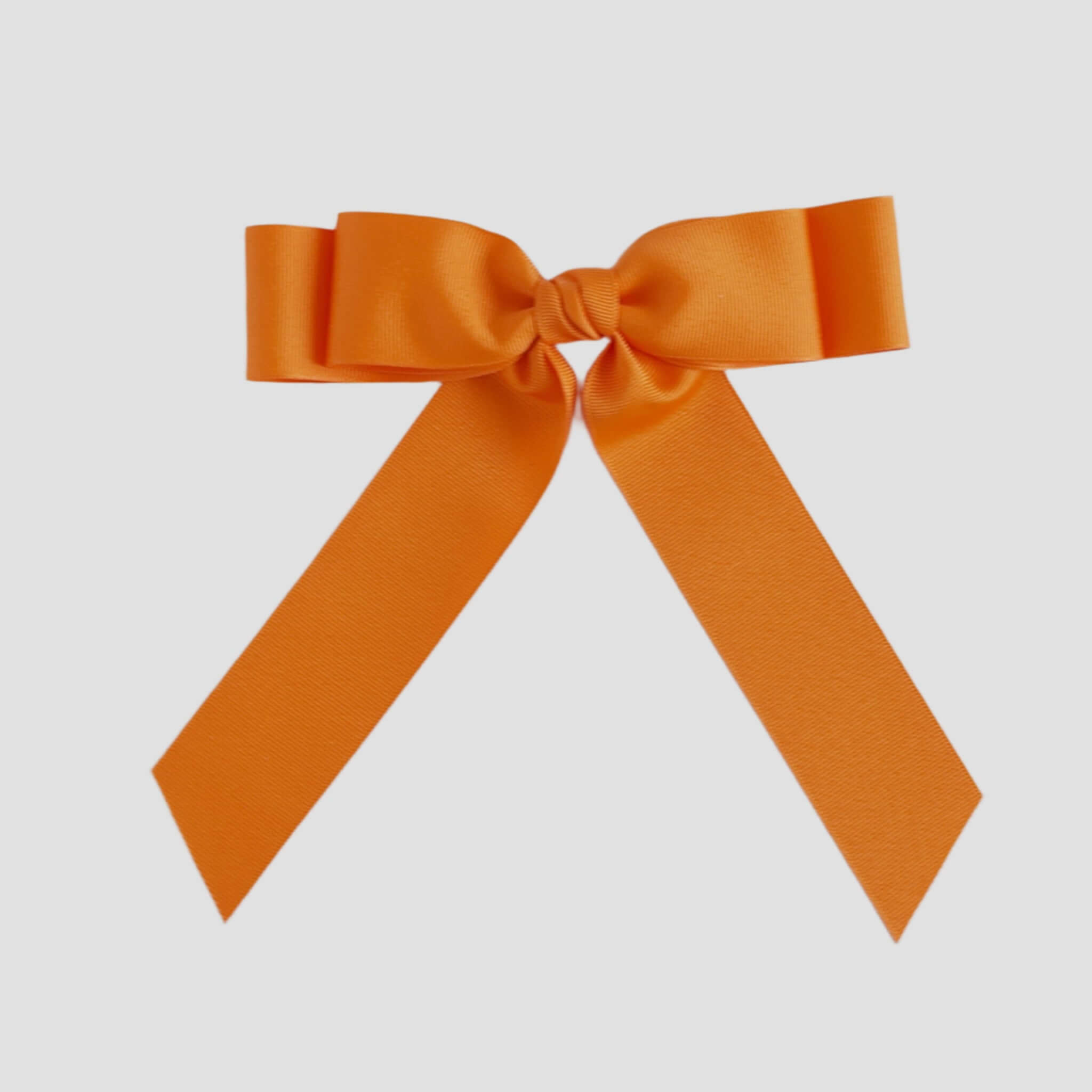 Orange bow on a white background
