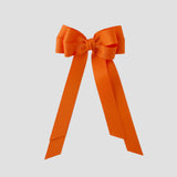 Orange grosgrain emerson bow on a white background