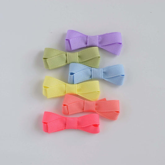 Pastel mini grosgrain hair bows for baby and toddler girls with snap clip and no-slip grip