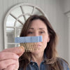 Video of woman styling hair with a satin bow comb clip