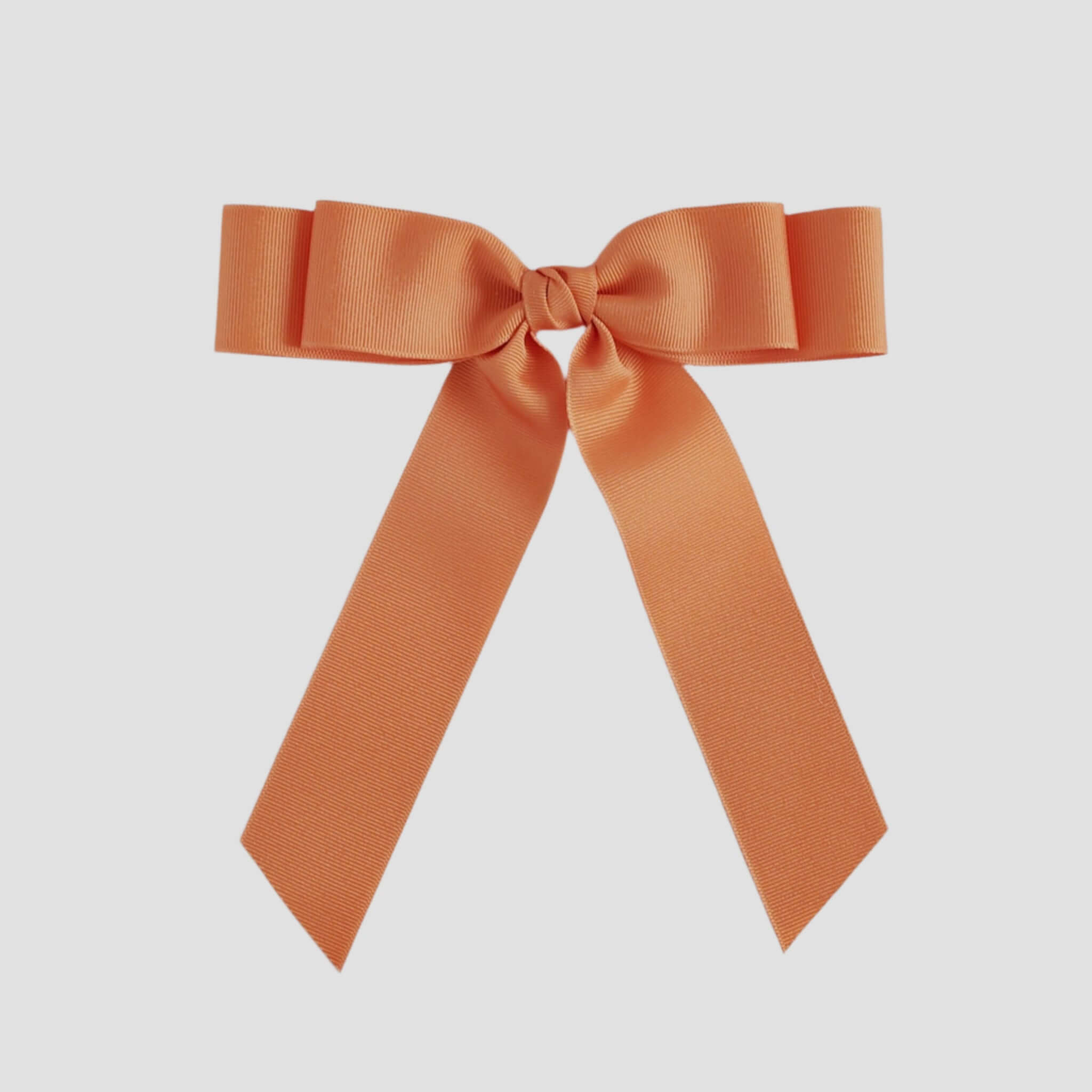 Pumpkin orange bow on a white background