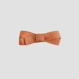 Pumpkin orange bow on a white background