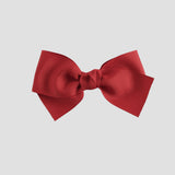 Red bow on a white  background