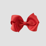 Red bow on a white background