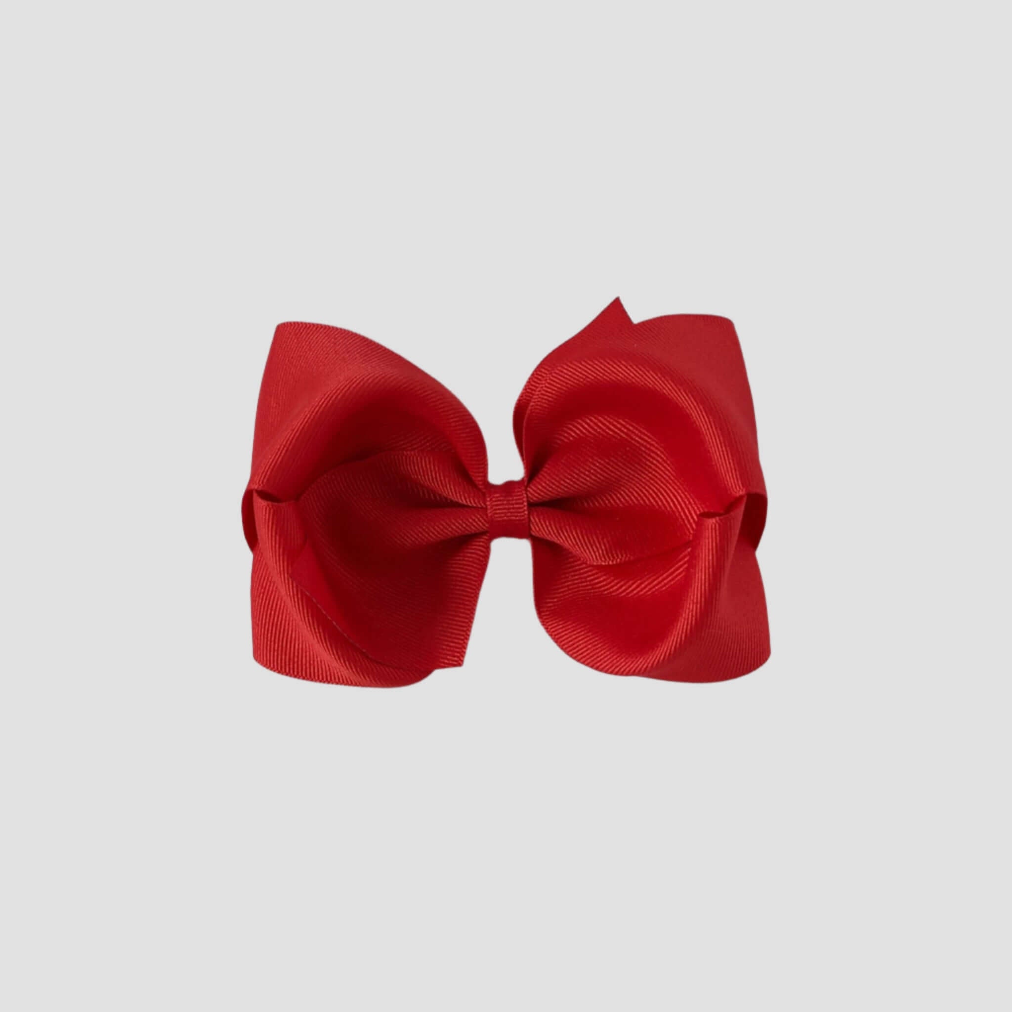 Red hair bow on a white background
