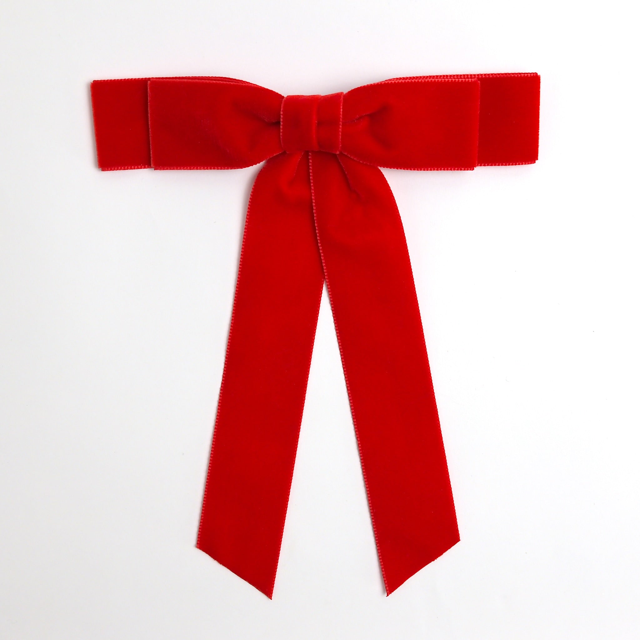 Red Grace velvet hair bow for women. Double bow with long tails on white background 