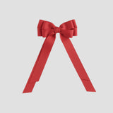 Red bow on a white  background