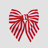 Red and white striped bow on a white background