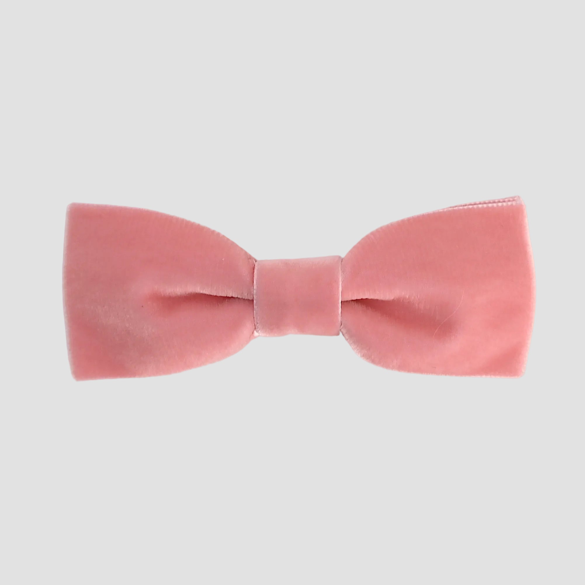 Rose pink men bow tie on a white background.