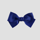 Royal blue bow on a white background