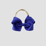 Royal blue bow on a nude nylon headband