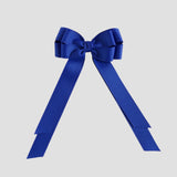 Royal blue bow on a white background
