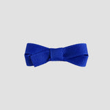 Royal blue bow on a white background