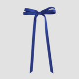 Royal blue ribbon bow on a white background