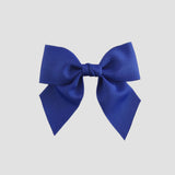 Royal blue bow on a white background
