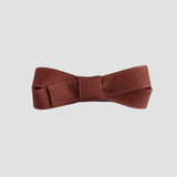 rust brown bow tie on a white background