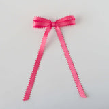Olivia Picot Satin Bow in vibrant pink, featuring charming picot edges for a stylish hair accessory.