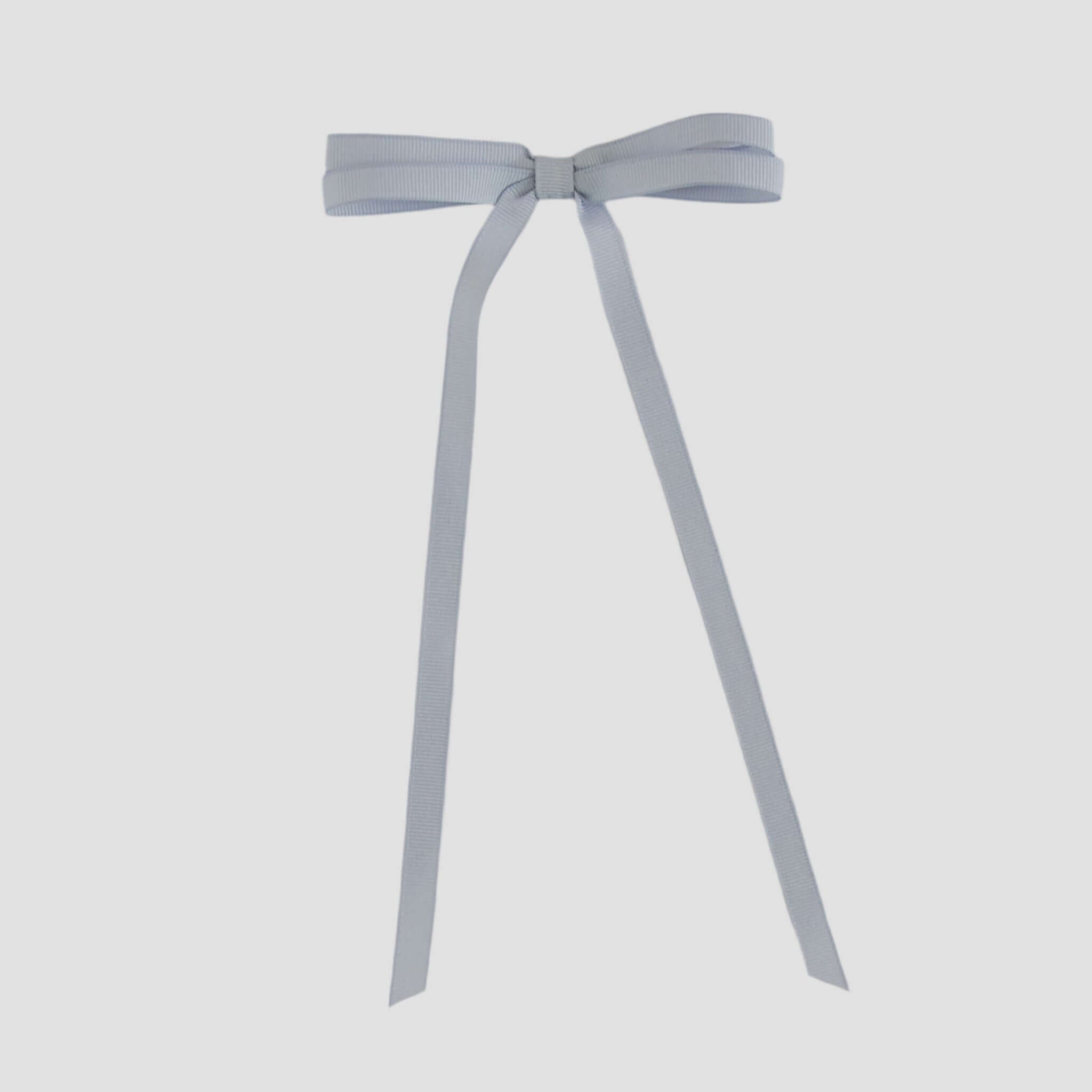 Silver gray ribbon bow on a white background