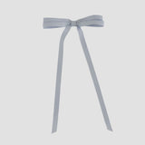 Silver gray ribbon bow on a white background