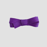 Sugar plum purple bow on a white background