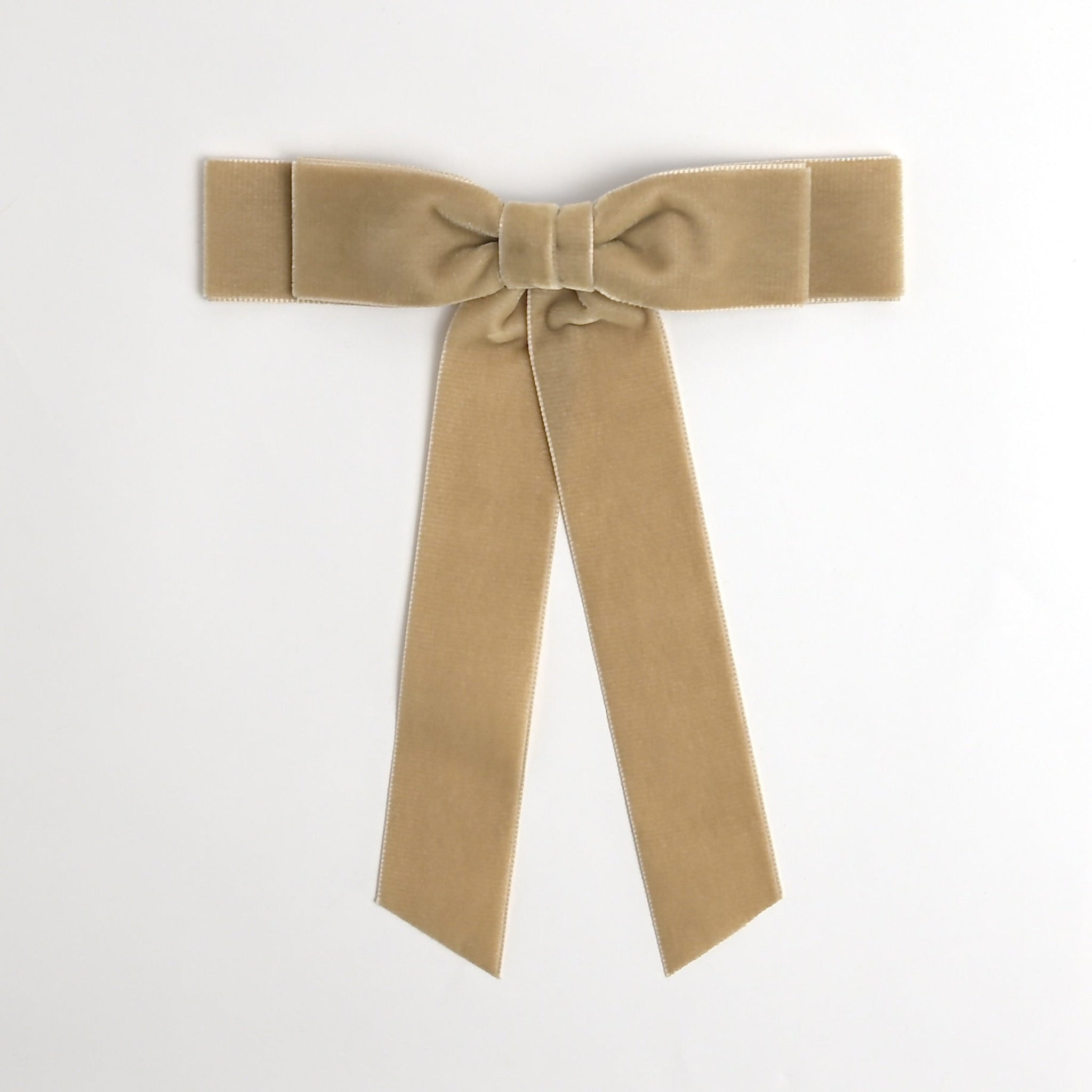 Beige Grace velvet hair bow for women. Double bow with long tails on white background 