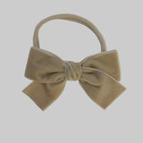 Beige Kayla velvet hair bow headband for newborn girl.