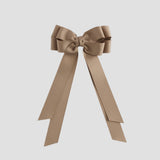 Taupe bow on a white background