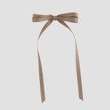 Taupe brown ribbon bow on a white background
