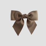 Taupe brown bow on a white background