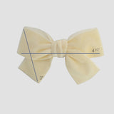 Ivory velvet Kayla bow showing bow size on a white background