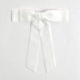 White Grace velvet hair bow for women. Double bow with long tails on white background 