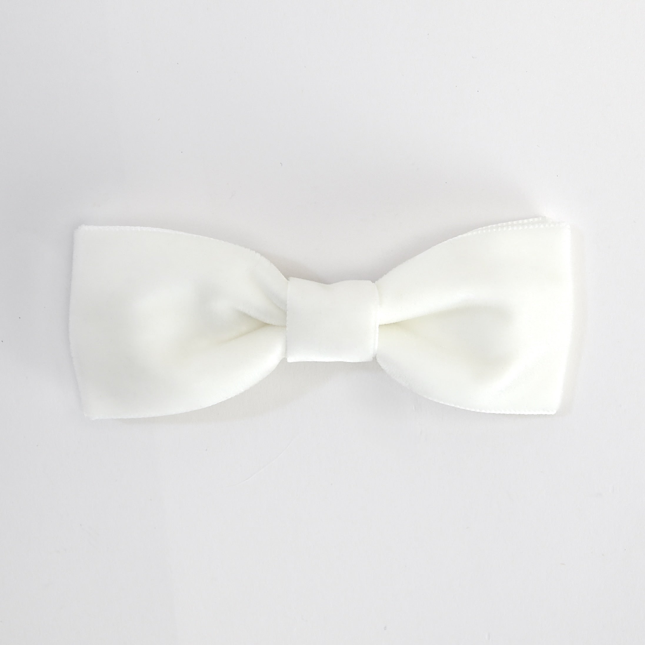 White men bow tie on a white background.