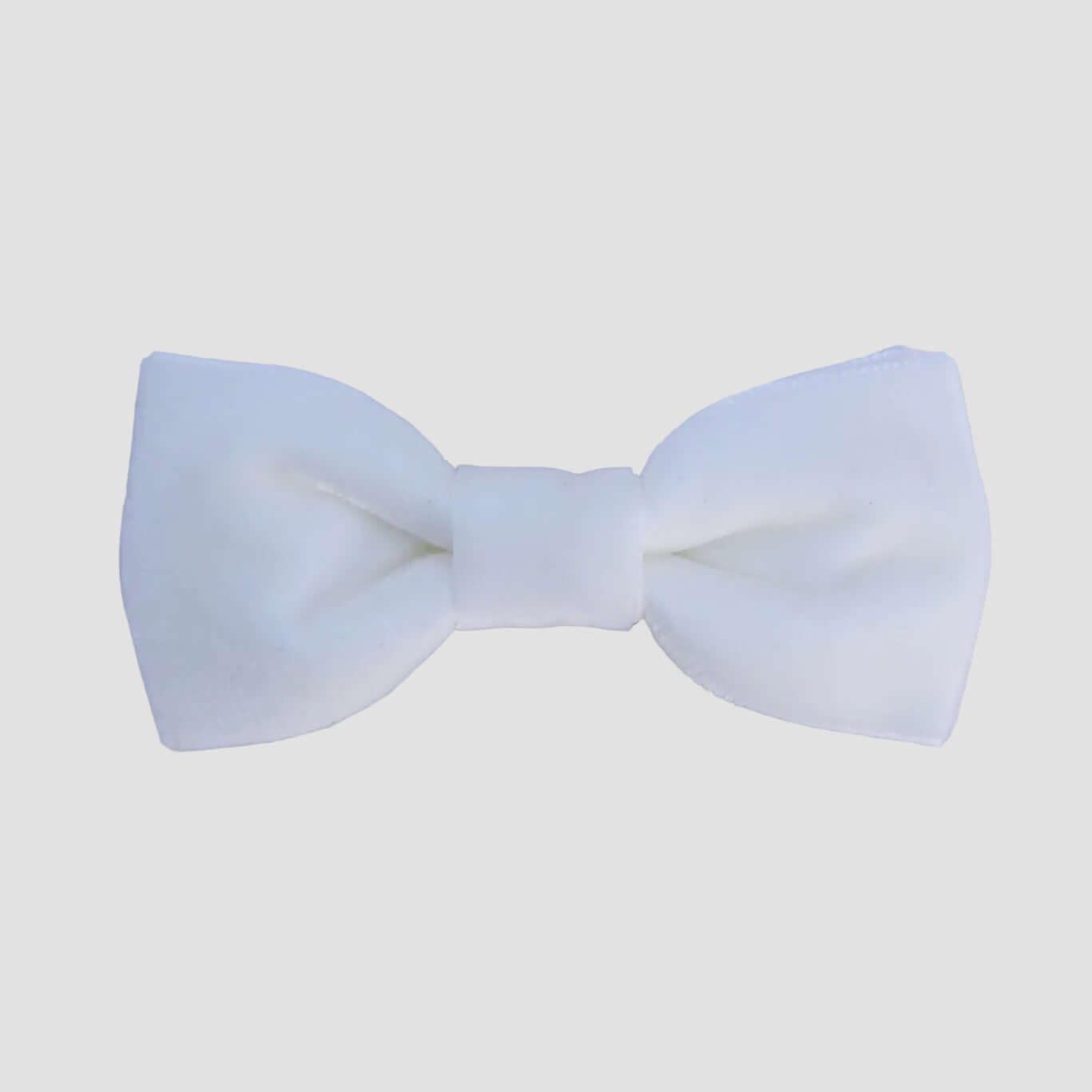 White velvet bow tie on a white background