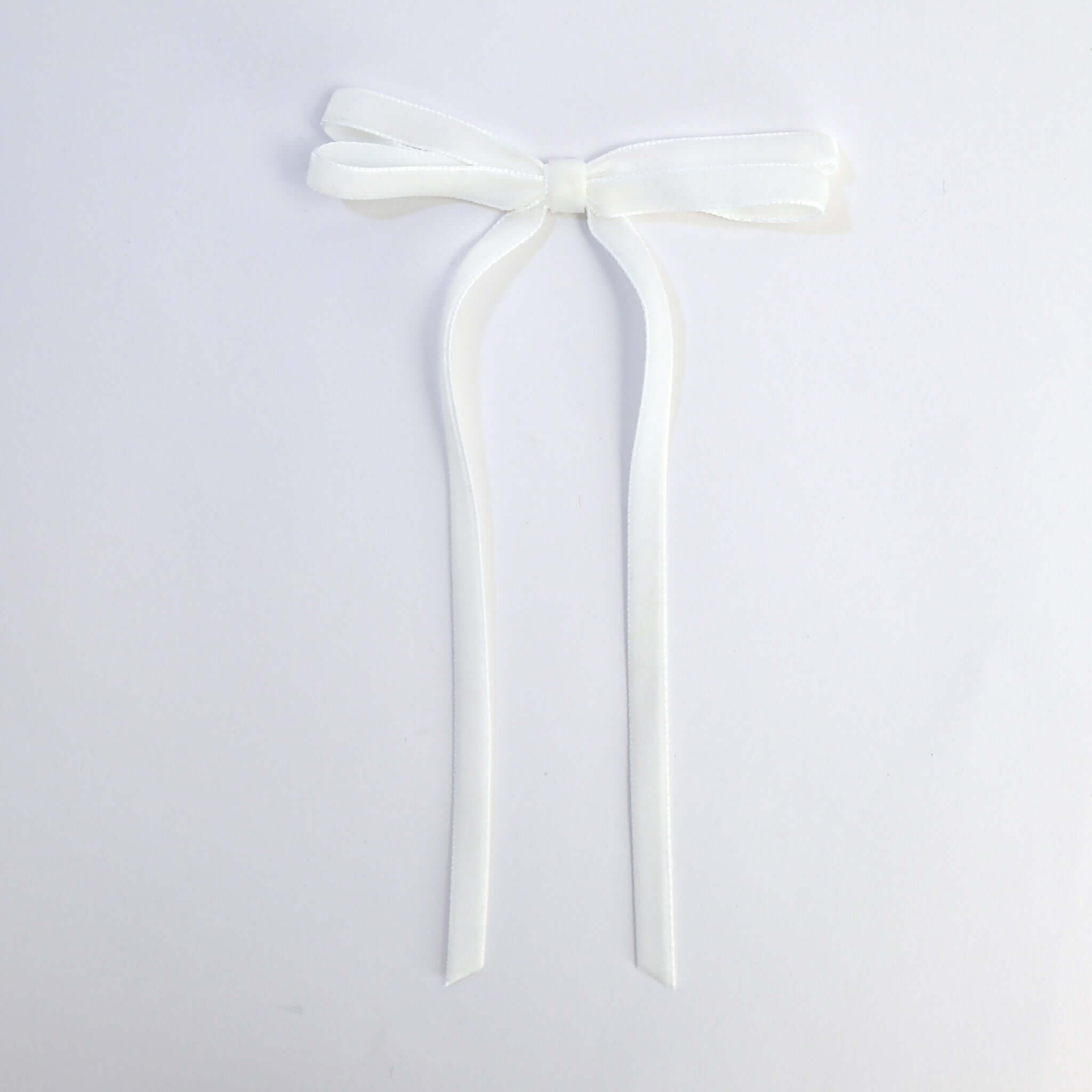white Olivia velvet hair bow for women with long tails on white background