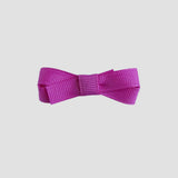 Wildberry pink bow on a white background