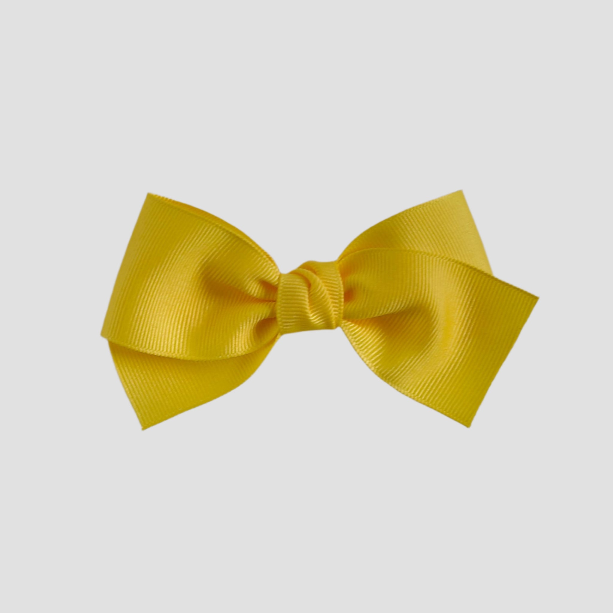 Yellow bow on a white background