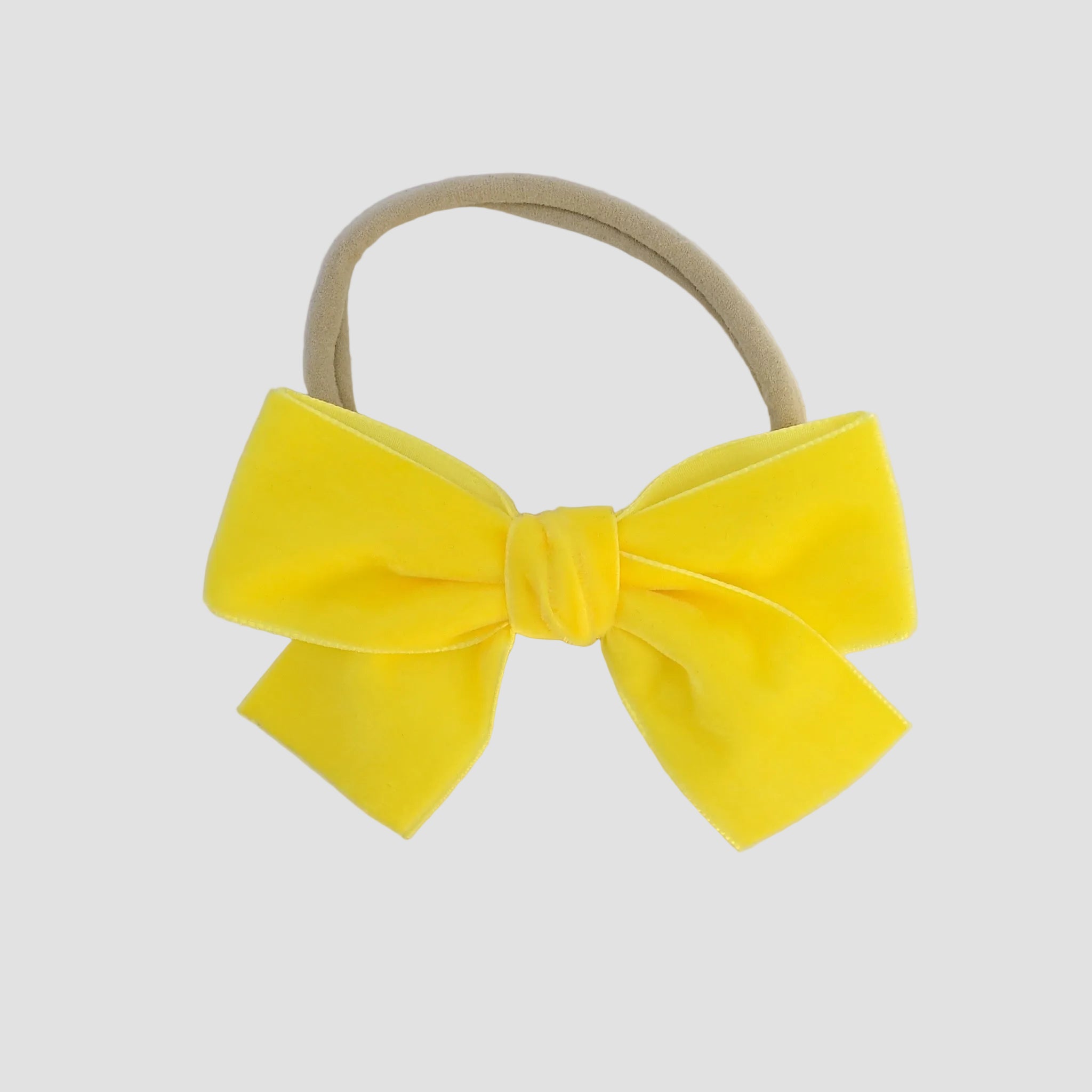 yellow Kayla velvet hair bow headband for baby girl.