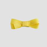 Yellow bow on a white background
