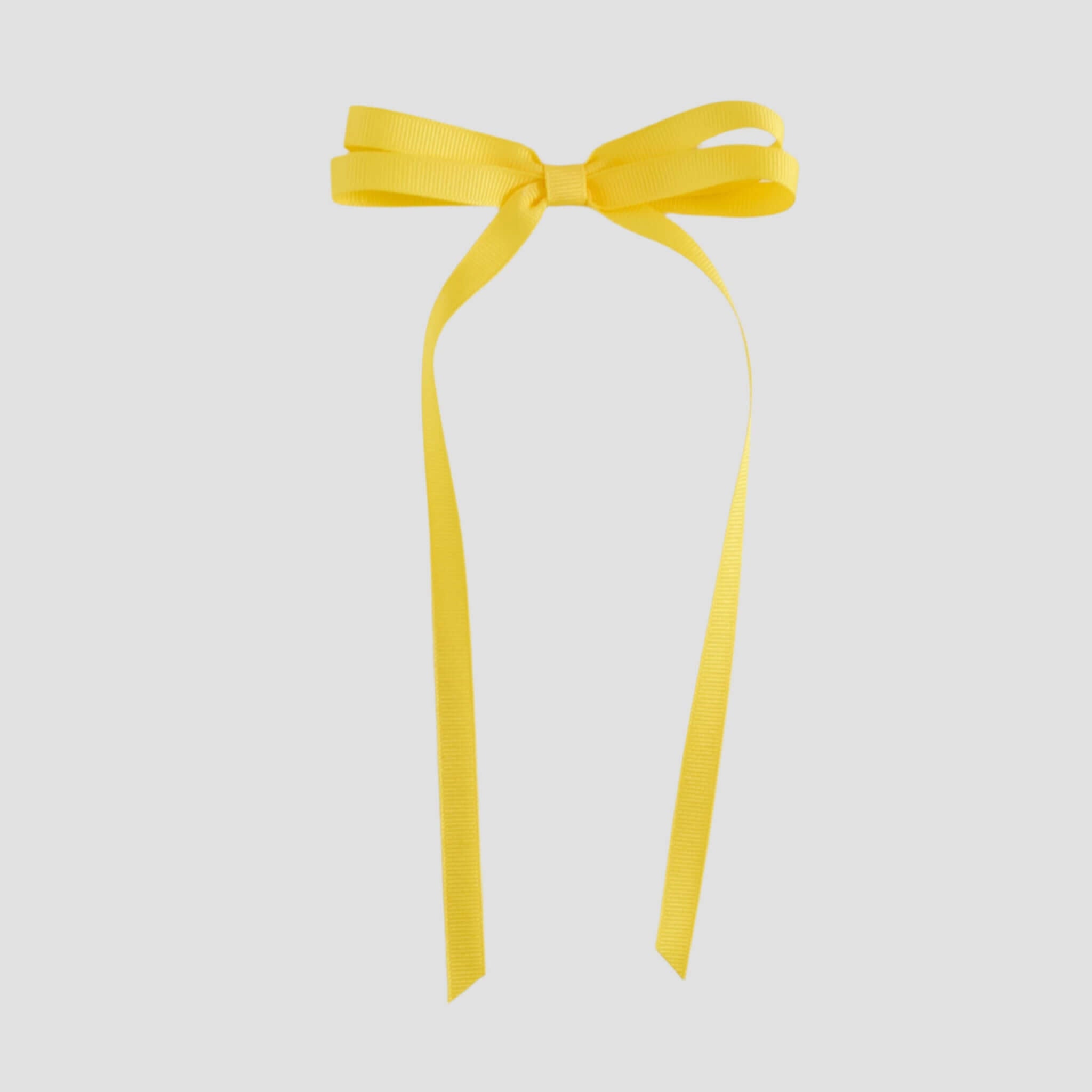 Yellow ribbon bow on a white background