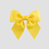 Yellow hair bow on a white background