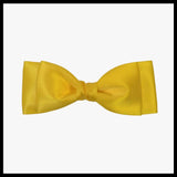 Ava satin bow in yellow on a white background