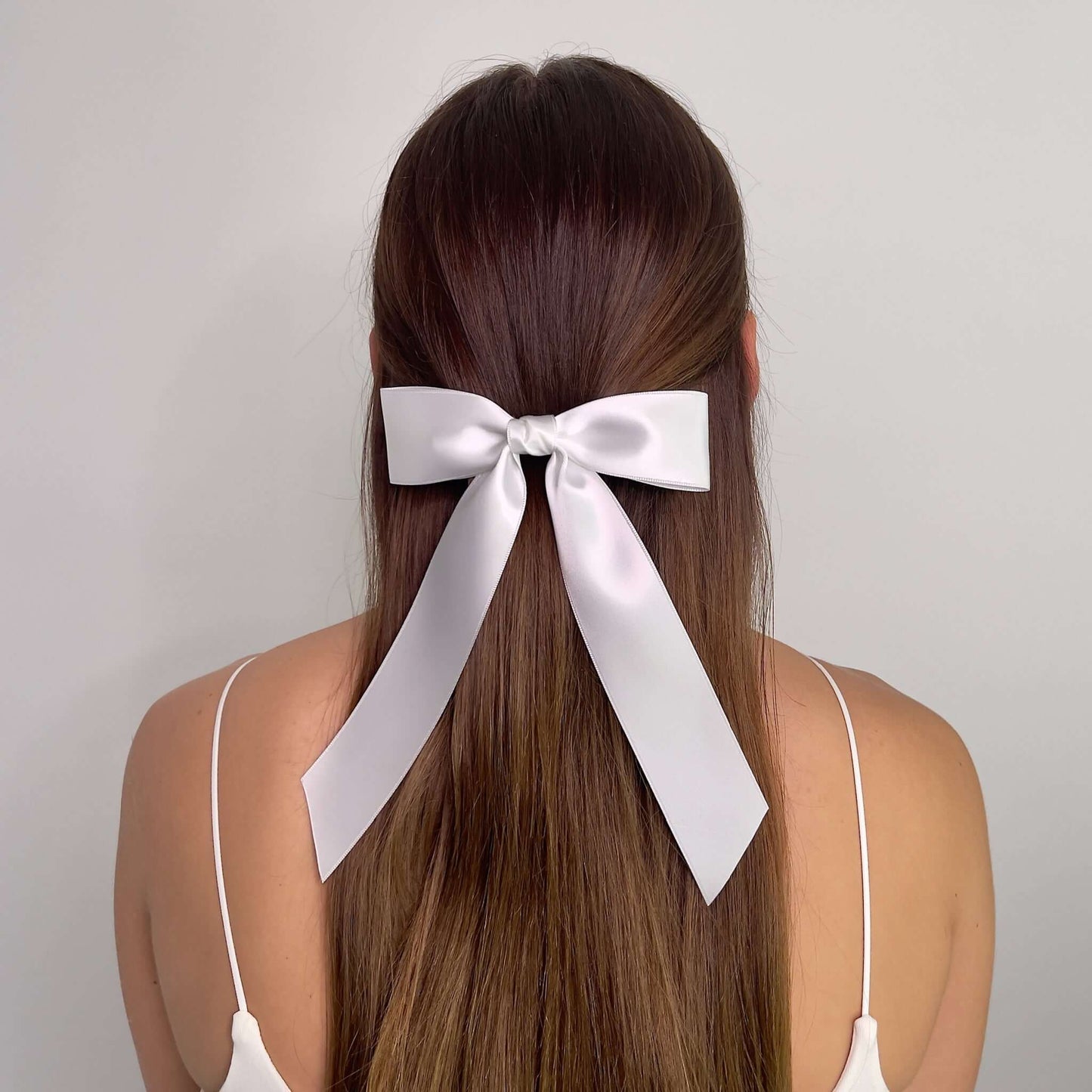 model wearing white bow